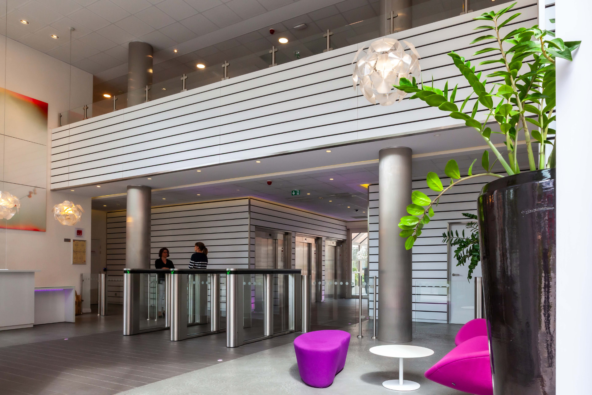 CLS Inside — lobby mezzanine and reception area with black slat detailing