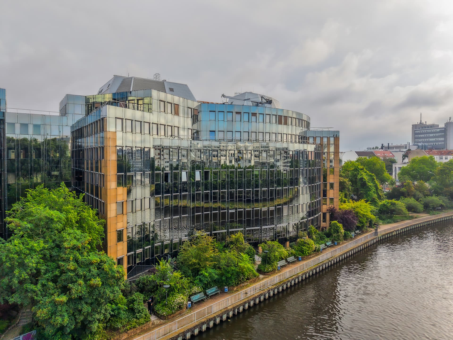 CLS Flexion — aerial view of the Flexion office building beside the river in Berlin