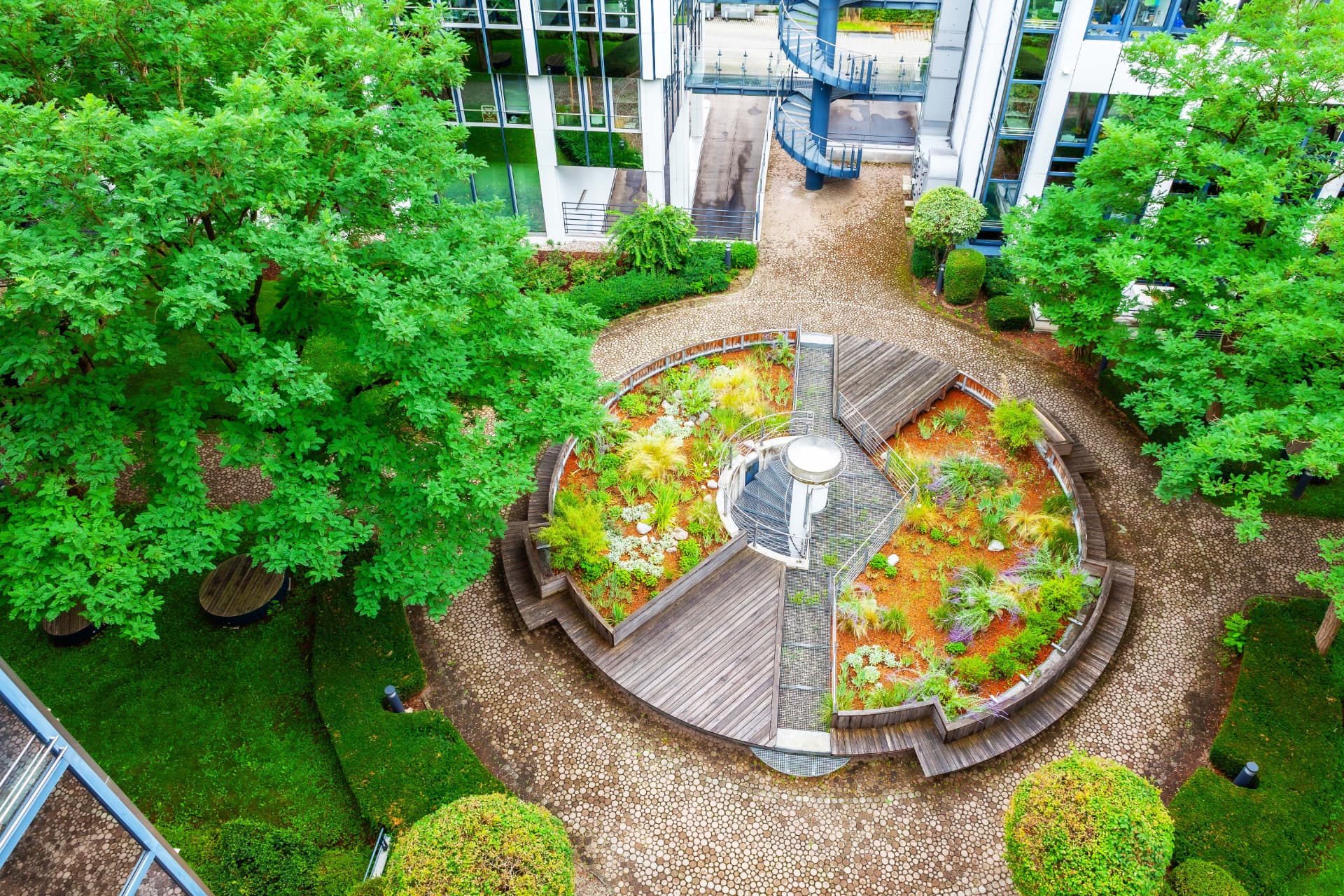 CLS Maximilianforum — aerial view of the circular rooftop garden courtyard in Munich